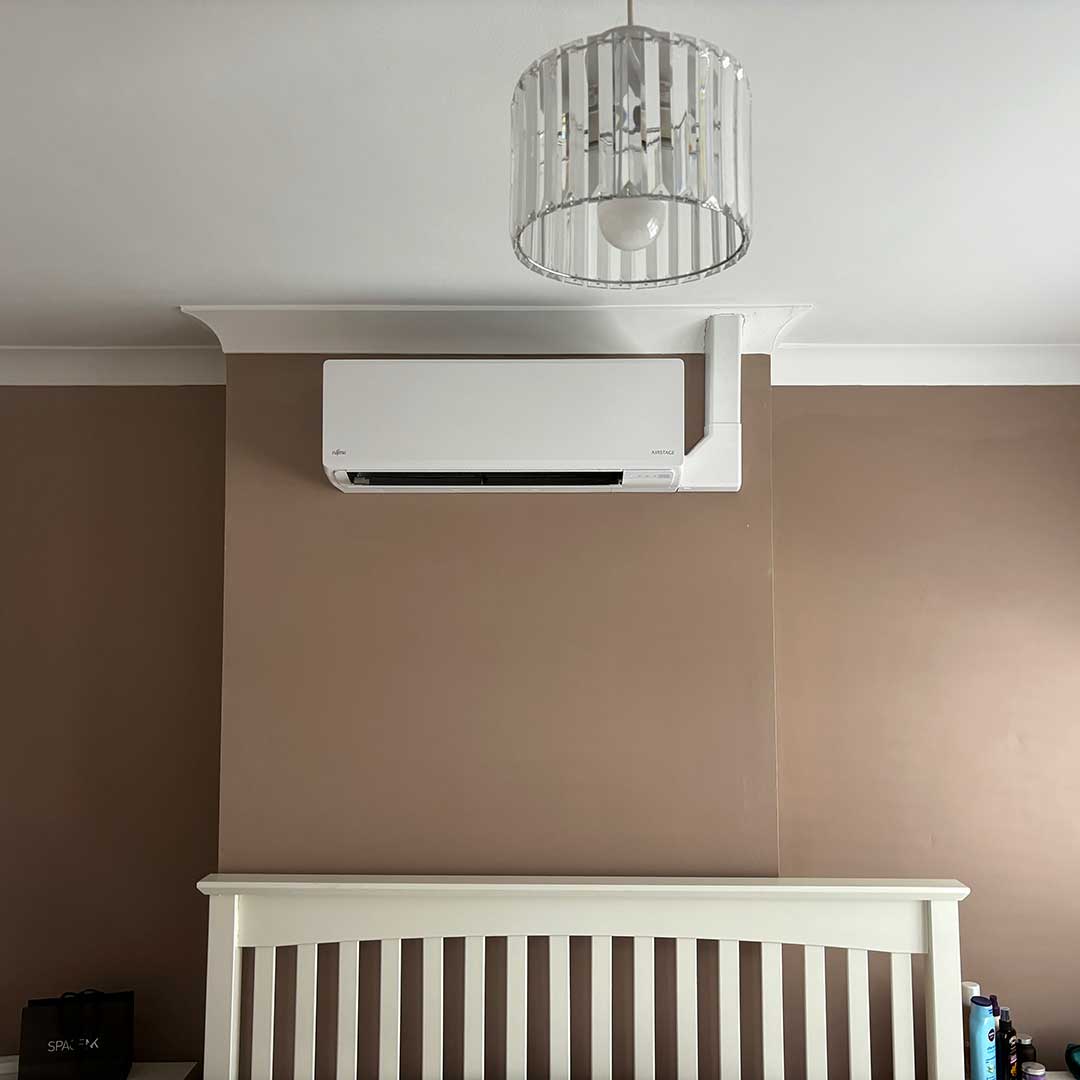 Alex-Wilson-Jones-Epsom-Aircon-unit-above-bed